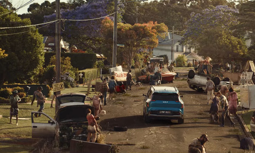 A Kia EV Drives Through a Zombie Horde