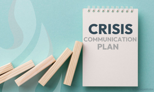 Falling wooden pieces on a notepad that says “crisis communication plan”