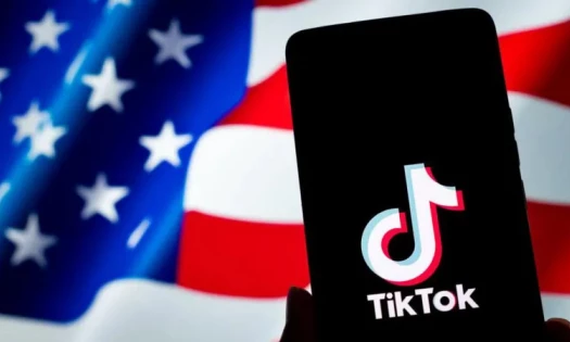 TikTok Logo in Front of the U.S. Flag