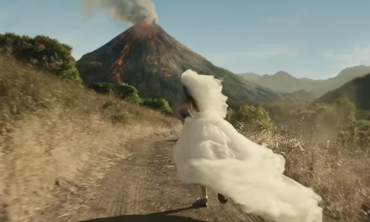 Bride running up the path to a volcano