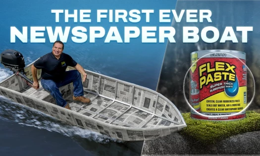 Phil Swift in a newspaper boat
