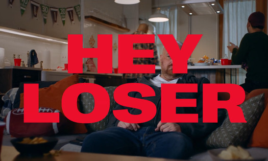 A man holds pizzas from 7-Eleven