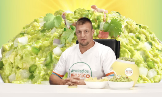Rob Gronkowski with a bowl of chips and guacamole dip