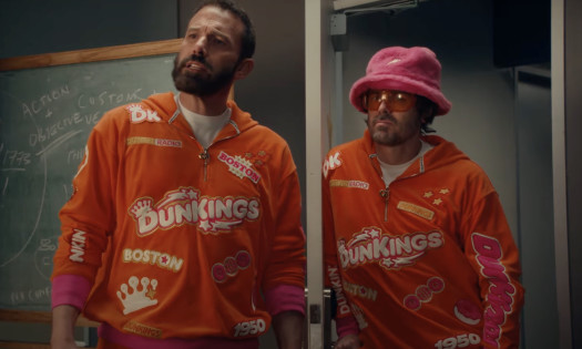 Jeremy Strong in a tub of ground coffee beans