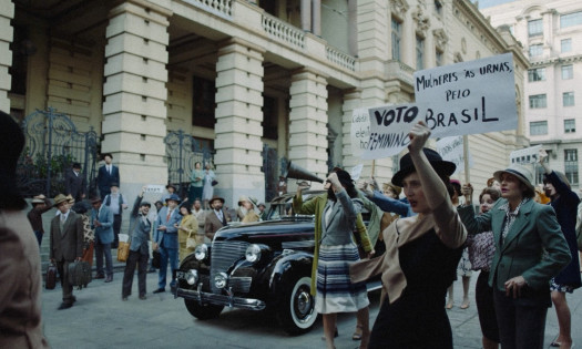 Women protesting with Chevrolet in the background
