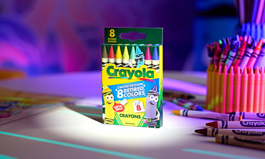 A box of Crayola's retired crayon colors on a desk