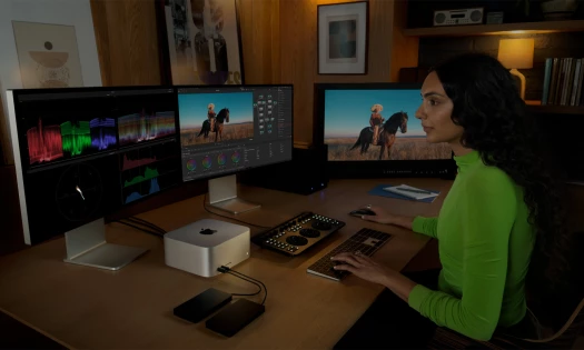 A woman editing on the new Mac Studio setup