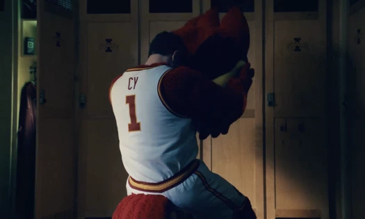 Student in the locker room who plays Cy the Mascot