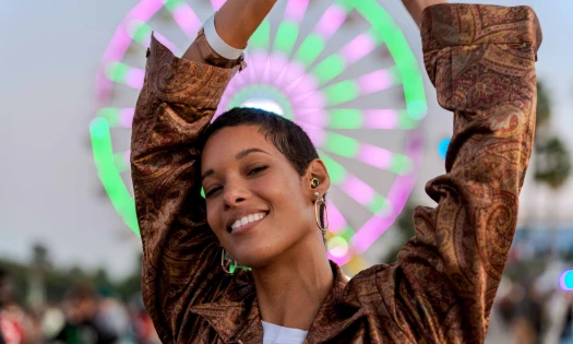 A woman at the Coachella Festival wears Loop earplugs