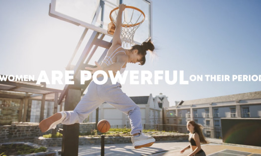 Women dunking on a basketball court