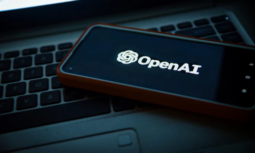 OpenAI logo showing on a phone screen