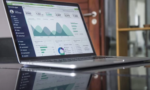 An image of a laptop displaying website analytics