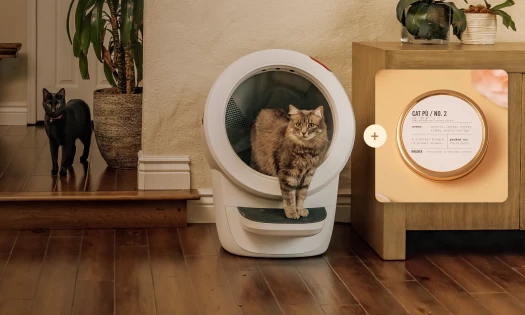 Whisker's Litter-Robot and candle