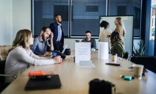 A group of people having a meeting in a boardroom