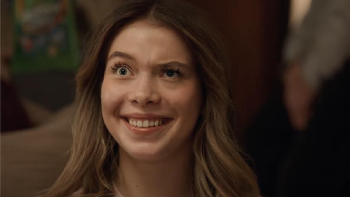 A teen funnily twitching her face in Skittles' new ad