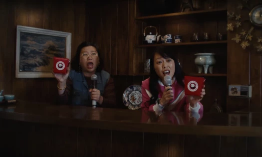 Aunties holding mics and Panda Express boxes