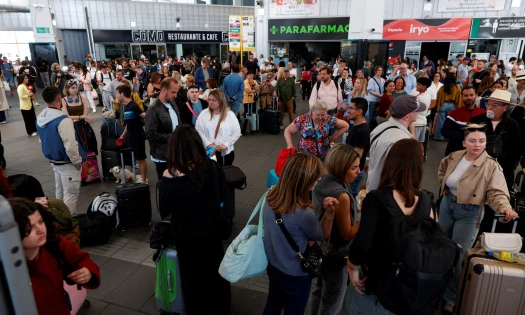 Passengers stranded at the Joaquin Sorolla train station in Spain
