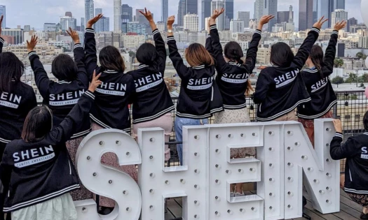 Women wearing SHEIN jackets waving