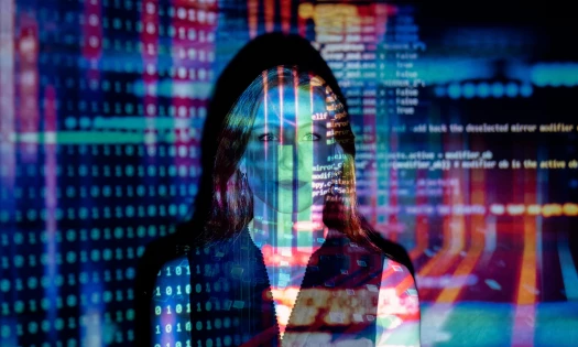 Woman Standing in Front of AI Code Projection