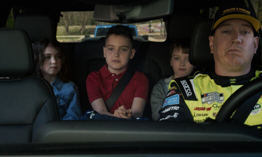 Kyle Busch with his kids inside a car
