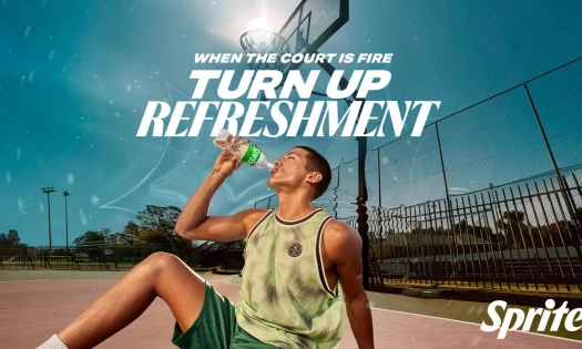 A man drinks Sprite on a hot summer day