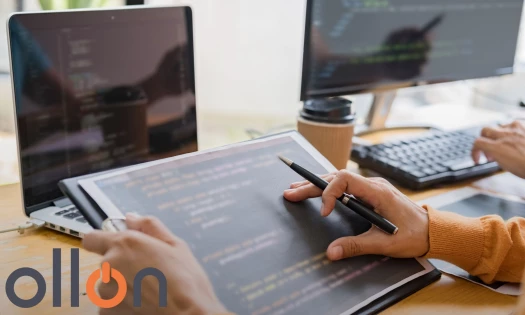 A person working on code on a tablet