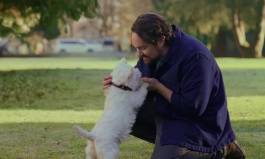 A man and his dog at the park