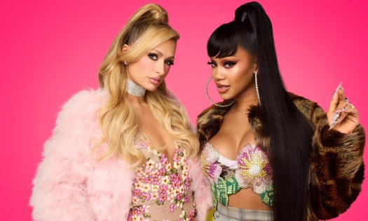 Paris Hilton and Saweetie posing for NYX against a hot pink backdrop