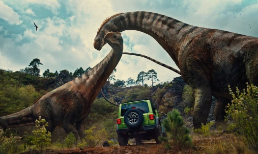 Two dinosaurs stand tall as a Jeep passes by