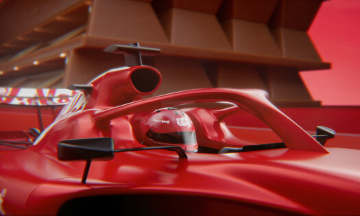 A KitKat-themed F1 car and racer on the track