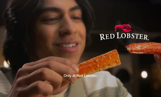 Man Indulging in Crabs Legs at Red Lobster's Crabfest 2025