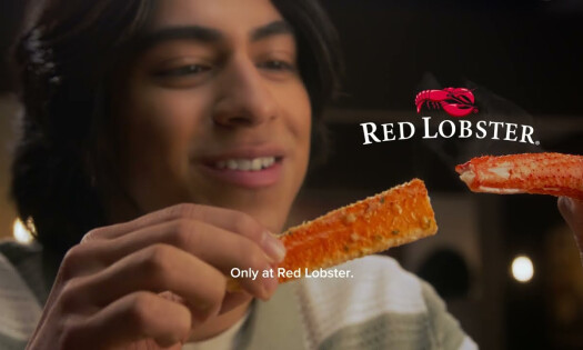 Man Indulging in Crabs Legs at Red Lobster's Crabfest 2025