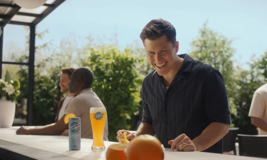 Colin Jost Laughs with Orange & Son in Blue Moon Ad