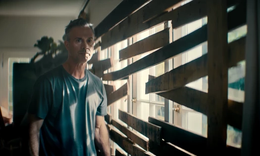 Freddie Prinze Jr. beside a sealed up window