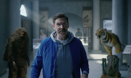 A man in a museum to talk about the evolution of wiping