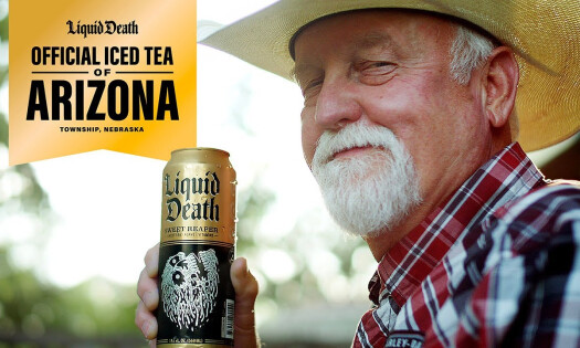 An old man holding up a can of Liquid Death