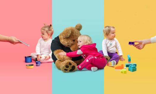 Three babies playing with toys