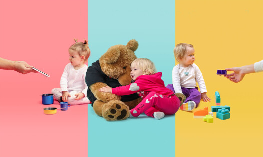 Three babies playing with toys
