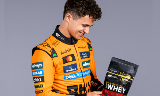 Lando Norris holding up ON Gold Standard Whey