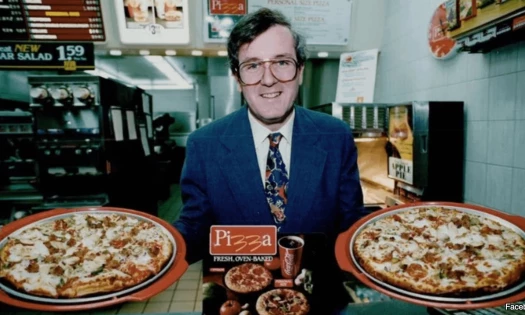 A man showcasing the McPizza in the '90s