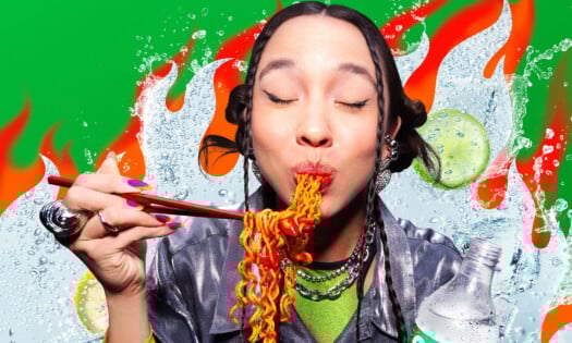 A woman enjoying her spicy noodles alongside Sprite