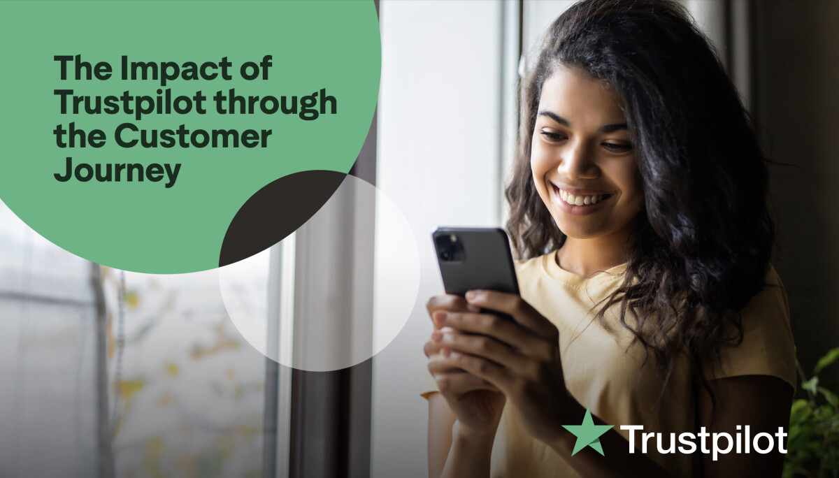 A woman using her phone with graphics of velocity home reviews that Trustpilot used as a test