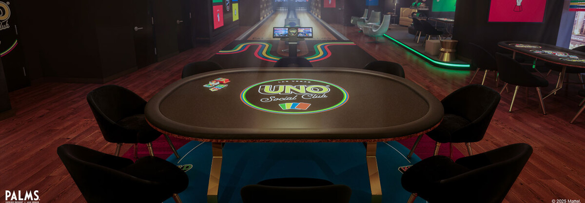 What looks to be a gambling table at the casino floor with the logo of UNO Social Club in the middle
