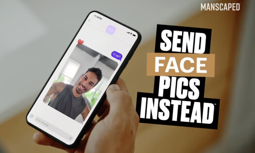 A woman looking at her phone as she sits inside a car