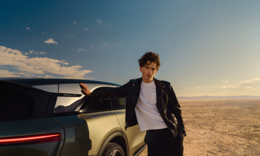 Timothée Chalamet posing with a Lucid vehicle