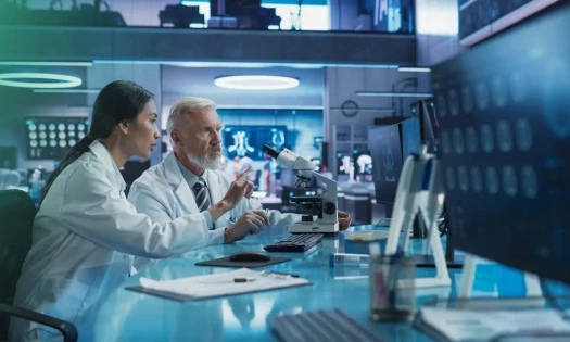 Two Scientists Focused on Lab Research