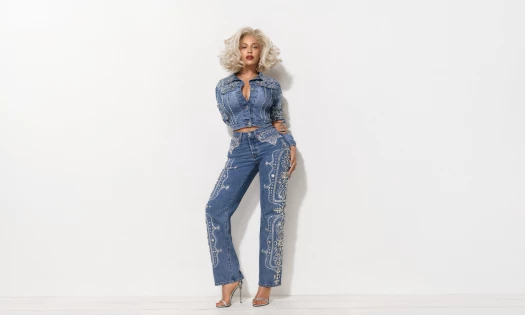 Beyoncé standing against a white backdrop rocking new Levi's pieces