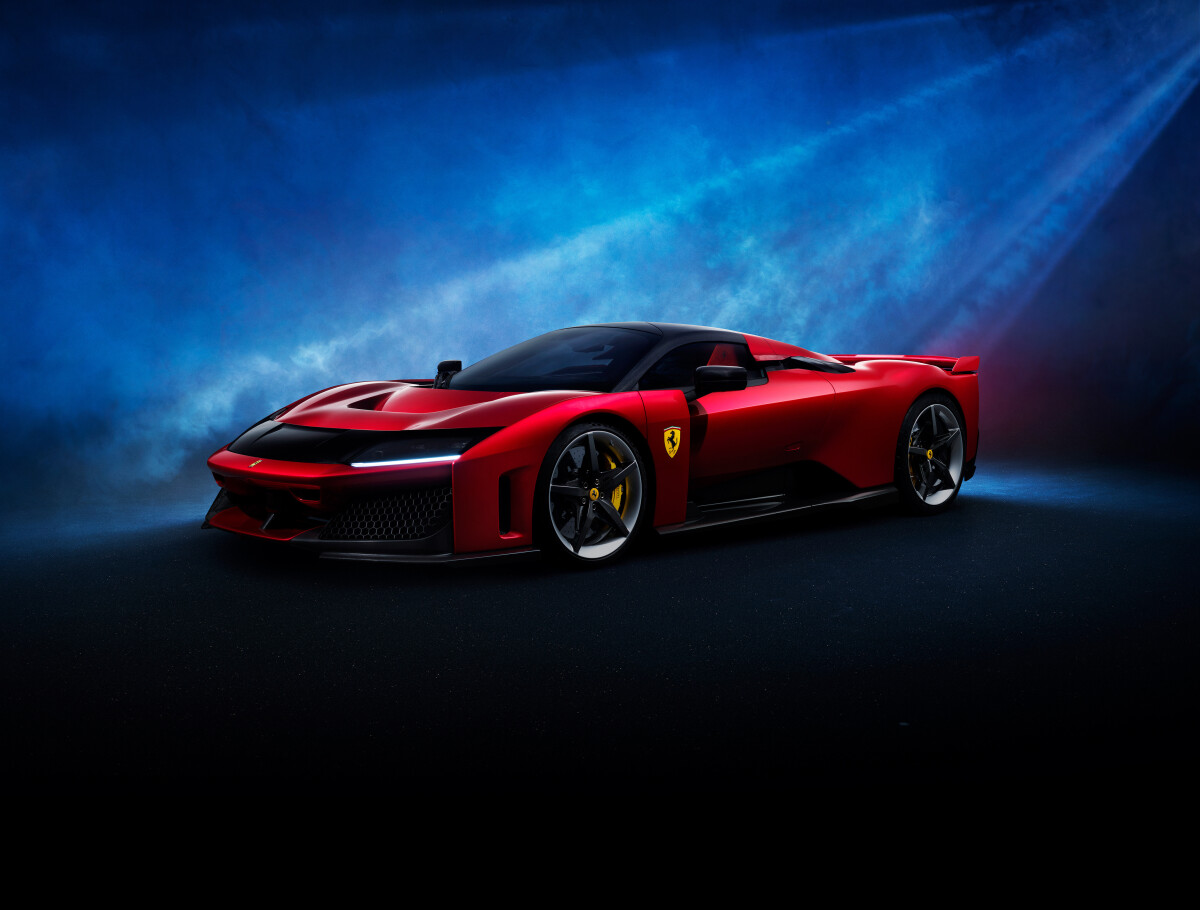 The Ferrari F80 in red against a blue backdrop