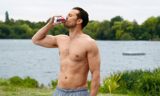 Jamie Dornan drinking Diet Coke by the lake