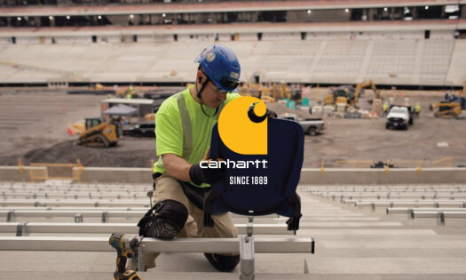 A service worker does his duty while wearing Carhartt workwear
